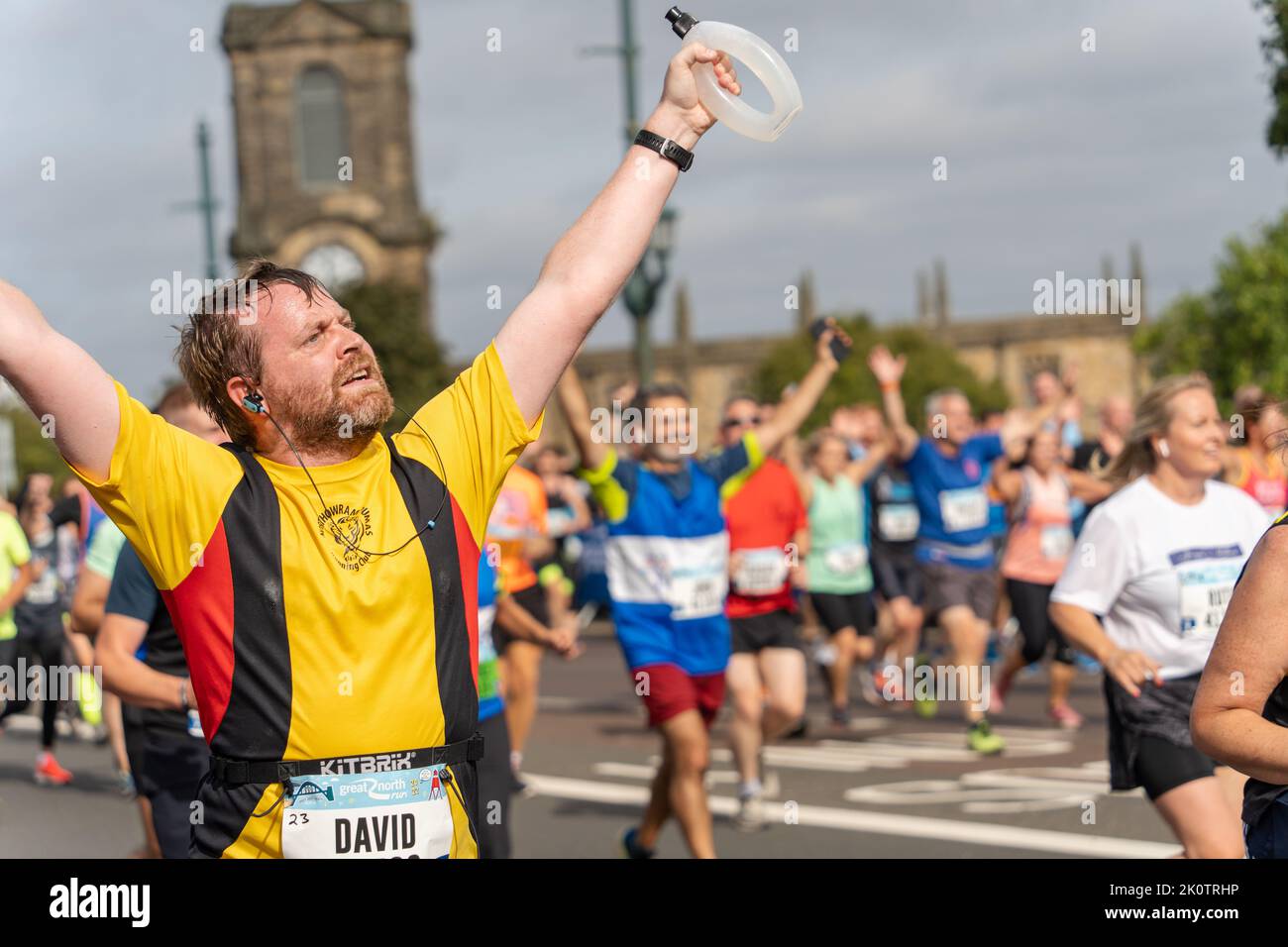 Participants, Great North Run 2022 half marathon, in Gateshead, just after crossing over the Tyne Bridge from Newcastle upon Tyne, UK Stock Photo