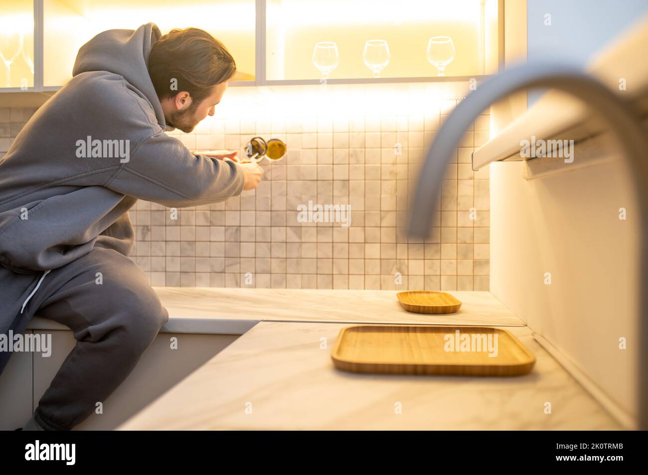 Professional installing an electrical outlet on the wall Stock Photo