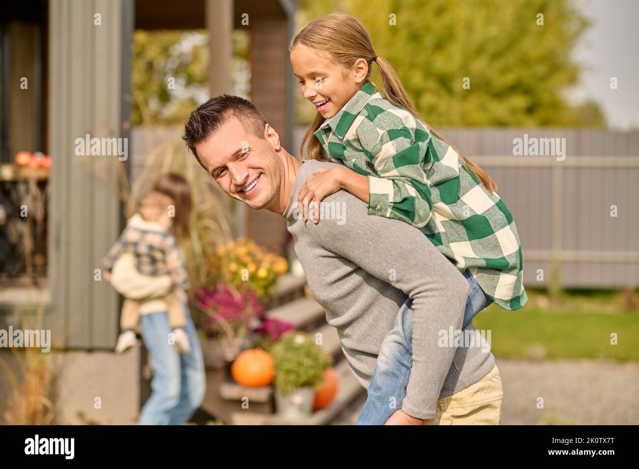 Dad giving son piggyback ride hi-res stock photography and images - Alamy
