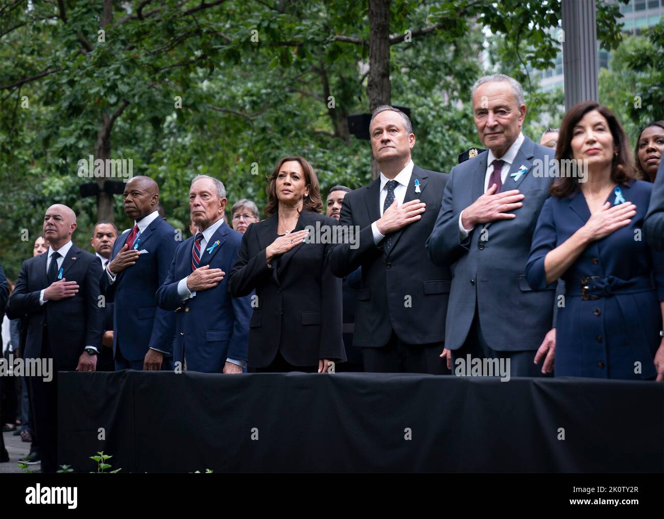 New York, United States of America. 11 September, 2022. U.S Vice President Kamala Harris, center, stands during a moment of silence at the ceremony remembering the victims of the 9/11 attacks at the National September 11 Memorial Museum, September 11, 2022 in New York City. Standing left to right are: Homeland Security Secretary Alejandro Mayorkas, Mayor Eric Adams, former Mayor Michael Bloomberg, Vice President Kamala Harris, Second Gentleman Doug Emhoff, Senate Majority Leader Chuck Schumer and Gov. Kathy Hochul.  Credit: Lawrence Jackson/White House Photo/Alamy Live News Stock Photo