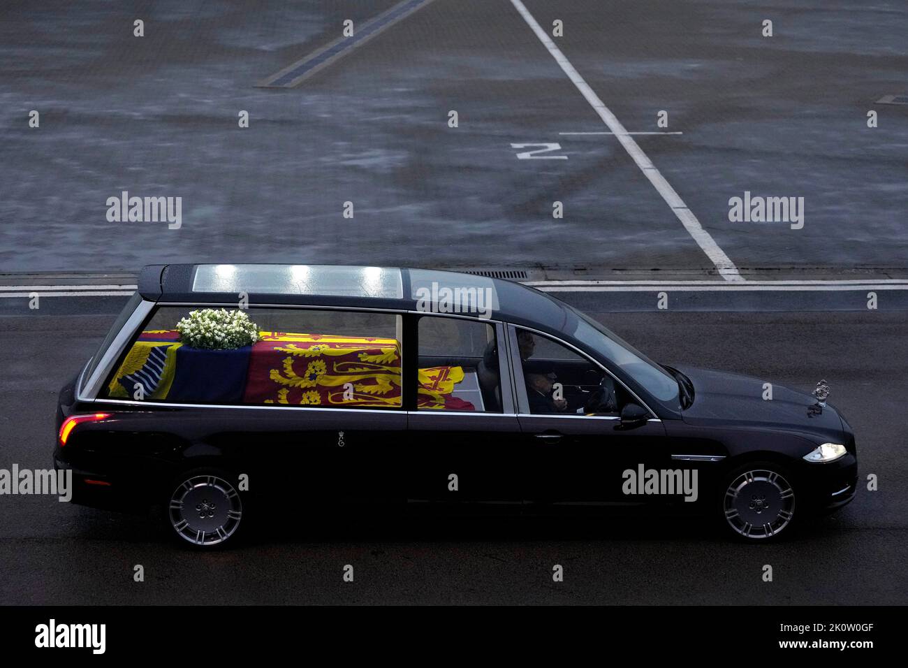 The coffin of Queen Elizabeth II carried in a State Hearse leaving RAF Northolt, west London, from where it will be taken to Buckingham Palace, London, to lie at rest overnight in the Bow Room. Picture date: Tuesday September 13, 2022. Stock Photo