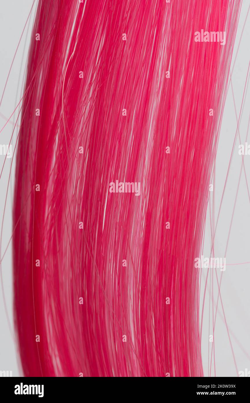 Pink straight hair strands texture macro close up view Stock Photo