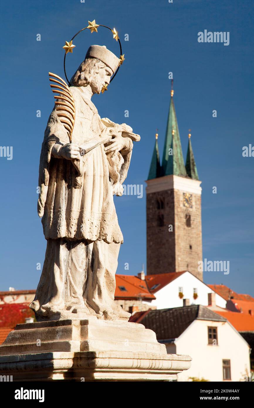 Evening view of Telc or Teltsch town with statue of st. John of Nepomuk, World heritage site by unesco in Czech Republic, Moravia Stock Photo