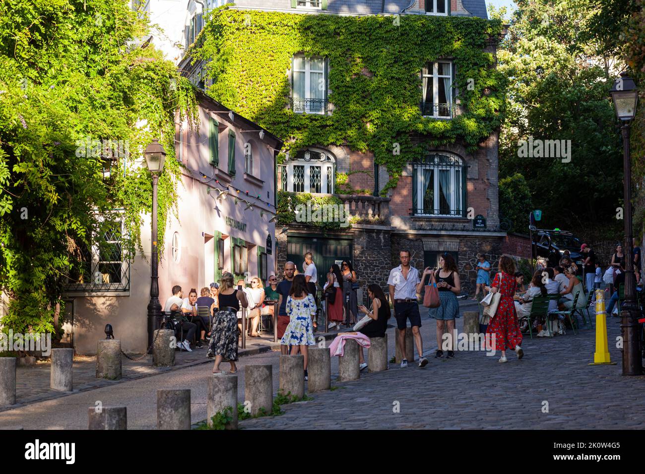 Paris, France - July, 15: Cozy old street with pink house restaurant called La Maison Rose at the quarter Montmartre in Paris on July 15, 2022 Stock Photo