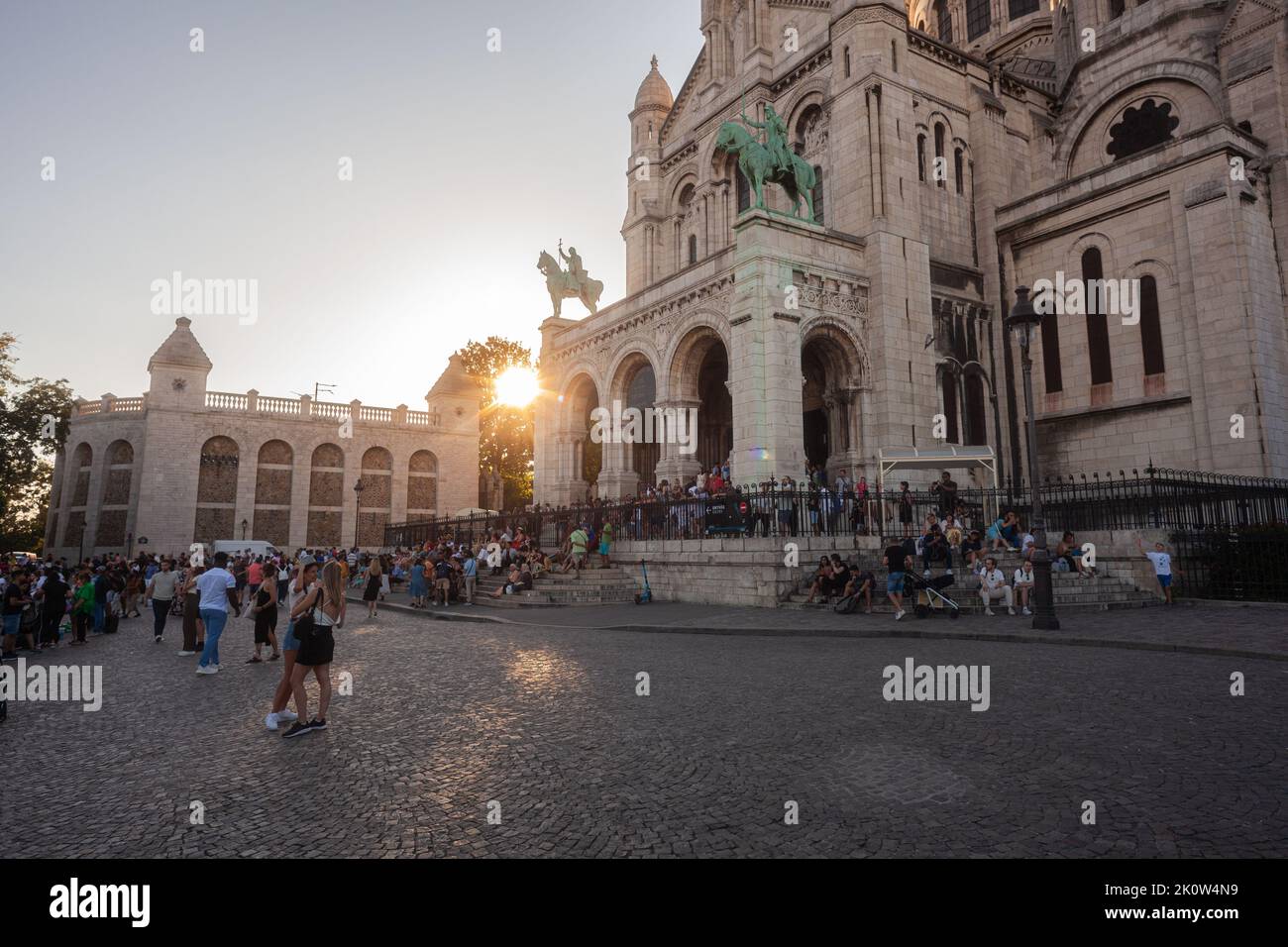 Sacre Coeur basilica, 'Basilica of the Sacred Heart of Jesus' with the Jeanne d'Arc statue in front of the main entrance. Paris, Montmartre, France. Stock Photo