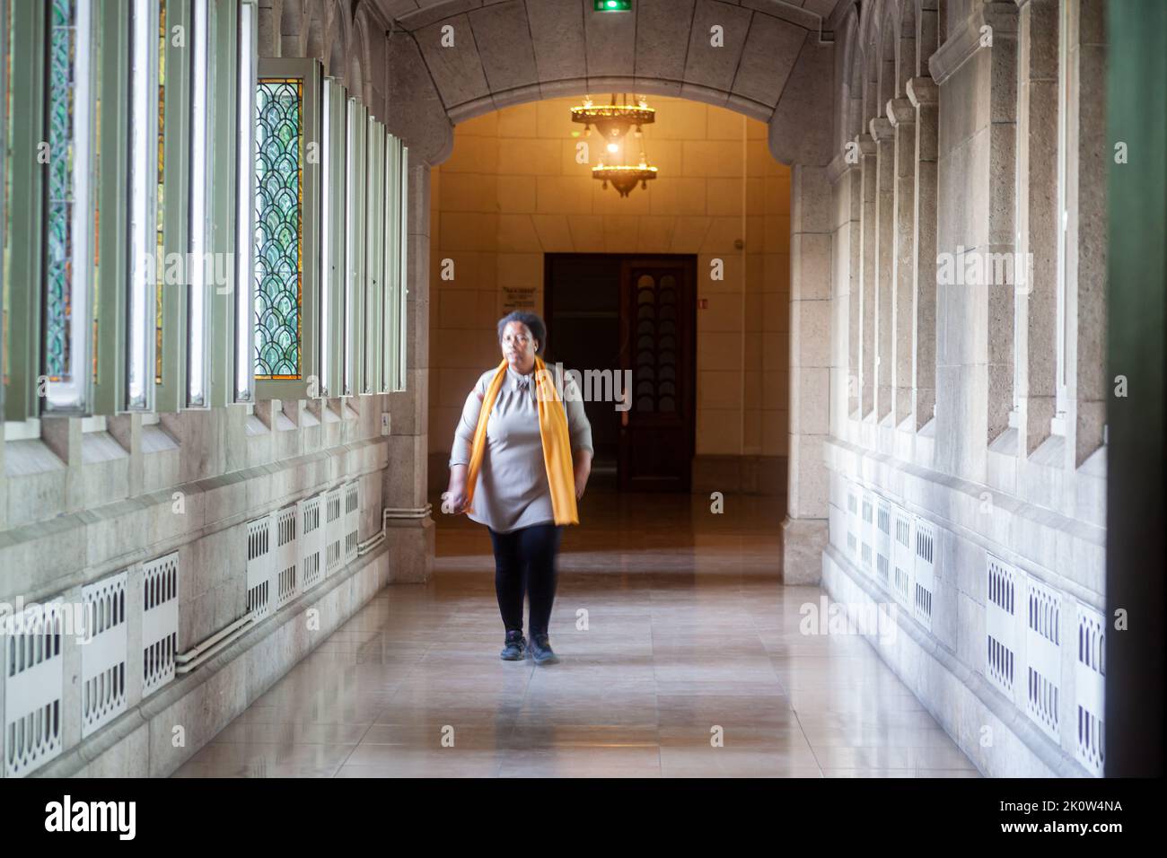 Paris, France - July, 15: Woman walking in the hallway of the Sacred Heart of Montmartre called Sacré Coeur on July 15, 2022 Stock Photo