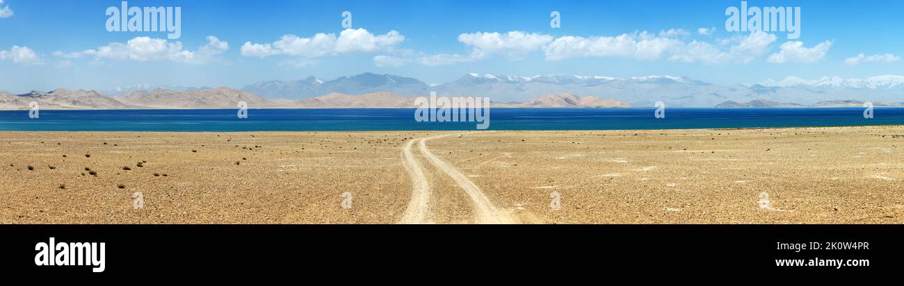 Karakul lake and Pamir range in Tajikistan. Landscape around Pamir highway M41 international road, roof of the world Stock Photo