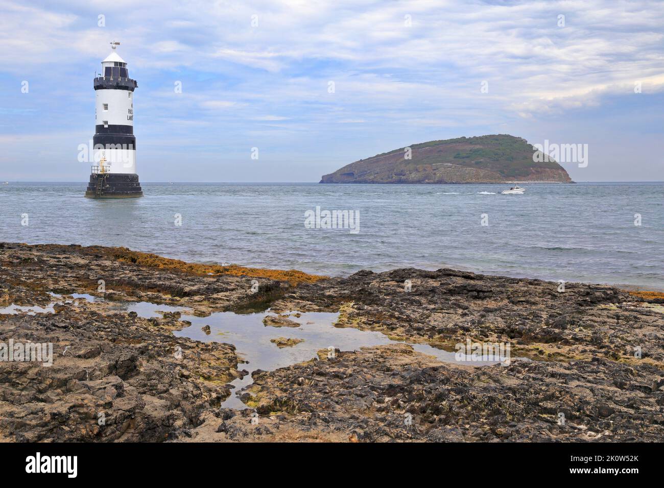 Penmon Lighthouse or Trwyn Du Lighthouse and Puffin Island, Penmon, Isle of Anglesey, Ynys Mon, North Wales, UK. Stock Photo