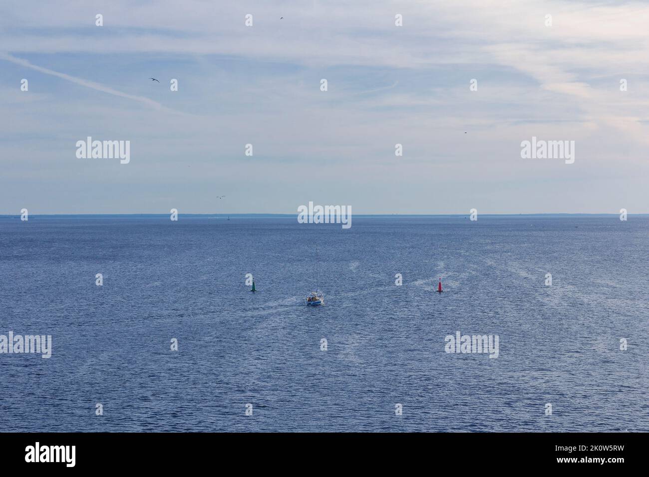 Red and green navigational buoys, starboard and port side buoys on open water Stock Photo