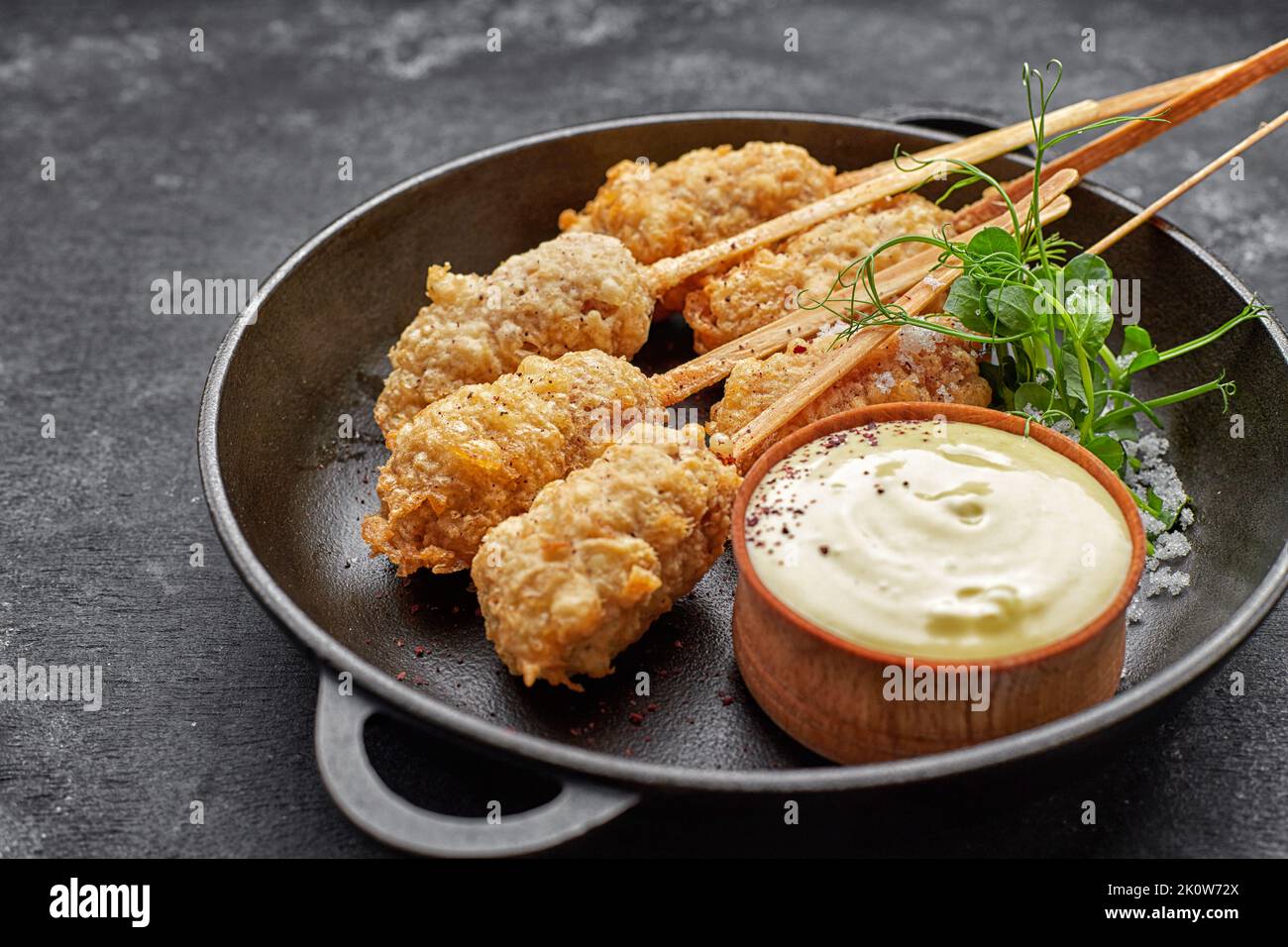 Tempura shrimp on a wooden stick in a pan Stock Photo