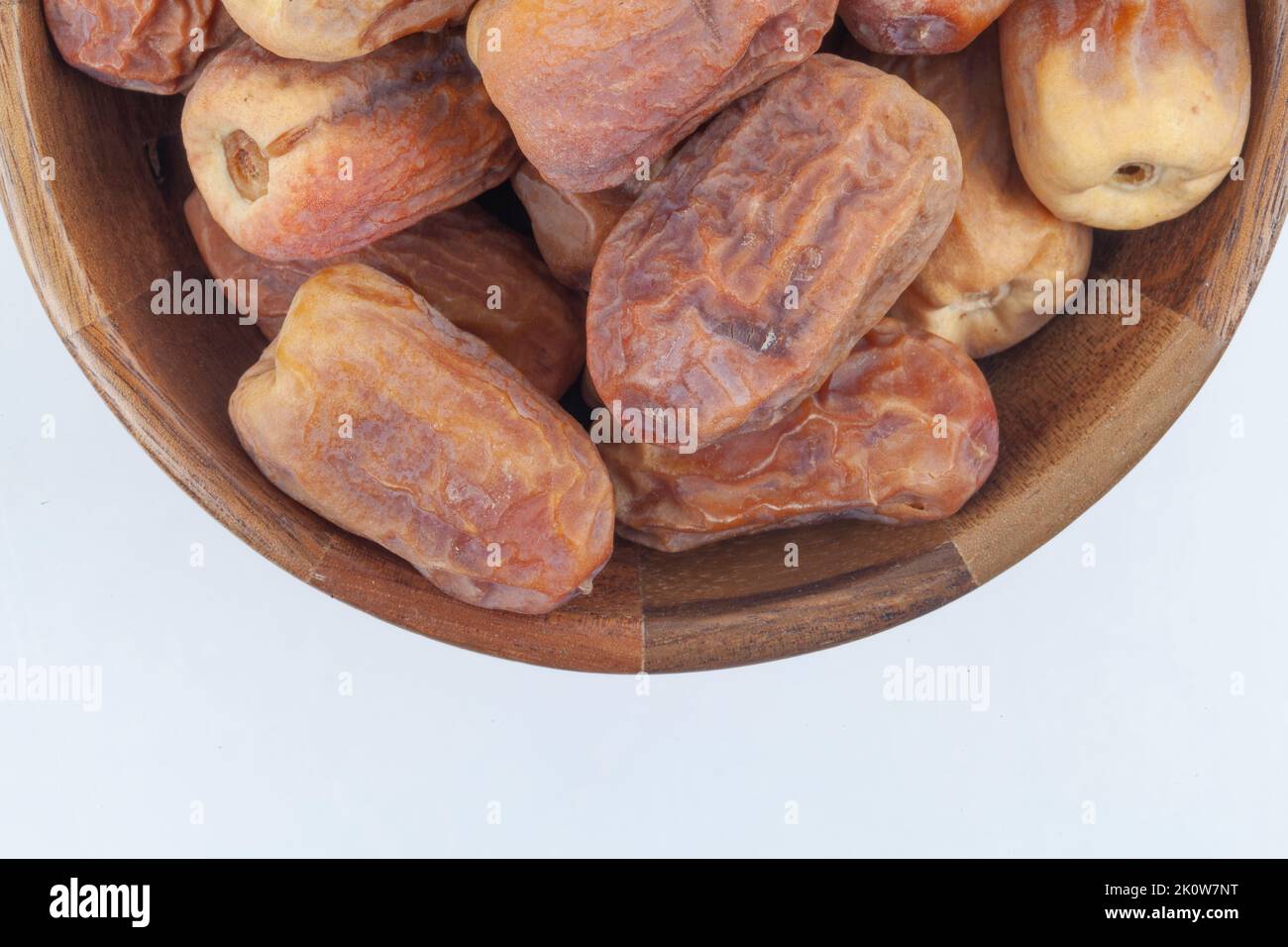 Dates in a wooden bowl on white background. dried dates fruit Stock ...