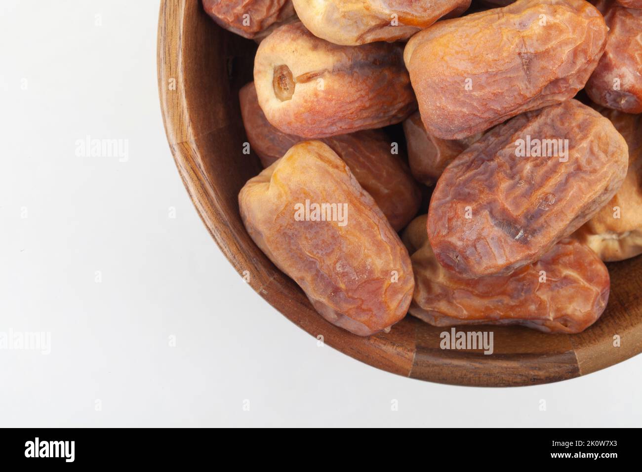 Dates in a wooden bowl on white background. dried dates fruit Stock ...
