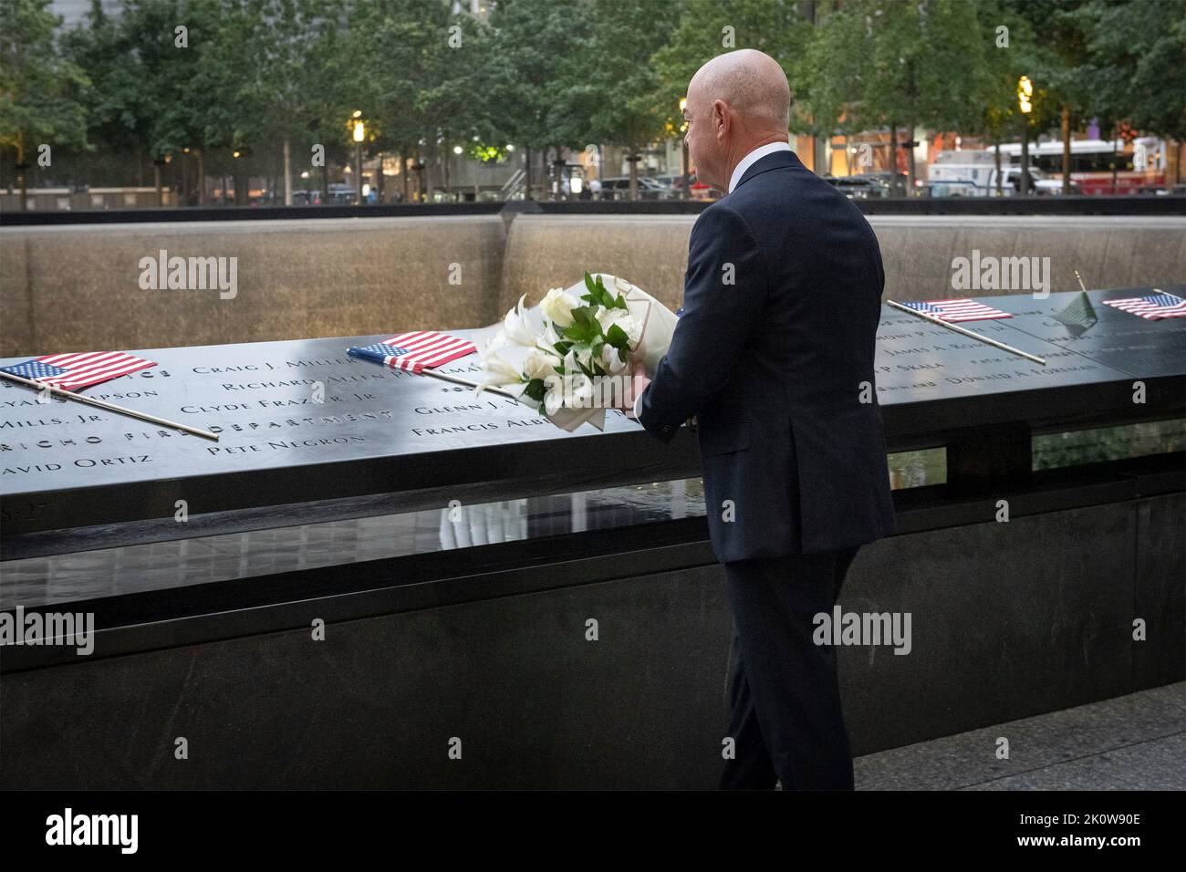New York, United States of America. 11 September, 2022. U.S Homeland Security Secretary Alejandro Mayorkas, places flowers in honor of Secret Service Special Officer Craig Miller during the ceremony remembering the victims of the 9/11 attacks at the National September 11 Memorial Museum, September 11, 2022 in New York City. The nation marked the 21st anniversary of the al-Qaida terrorists attacks that killed nearly 3,000 people.  Credit: Sydney Phoenix/DHS Photo/Alamy Live News Stock Photo