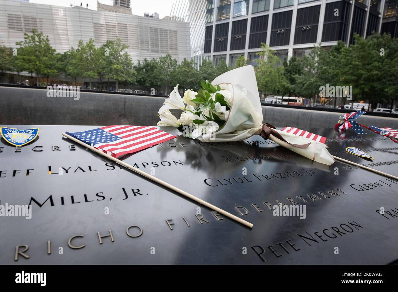 New York, United States of America. 11 September, 2022. Flowers and flags placed on the name of Secret Service Special Officer Craig Miller by U.S Homeland Security Secretary Alejandro Mayorkas, during the ceremony remembering the victims of the 9/11 attacks at the National September 11 Memorial Museum, September 11, 2022 in New York City. The nation marked the 21st anniversary of the al-Qaida terrorists attacks that killed nearly 3,000 people.  Credit: Sydney Phoenix/DHS Photo/Alamy Live News Stock Photo