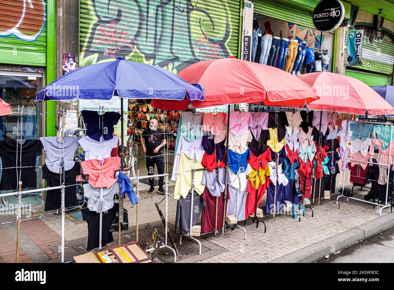 Bogota Colombia,Carrera 10,store stores business businesses shop shops market markets marketplace selling buying shopping,sidewalk display sale umbrel Stock Photo