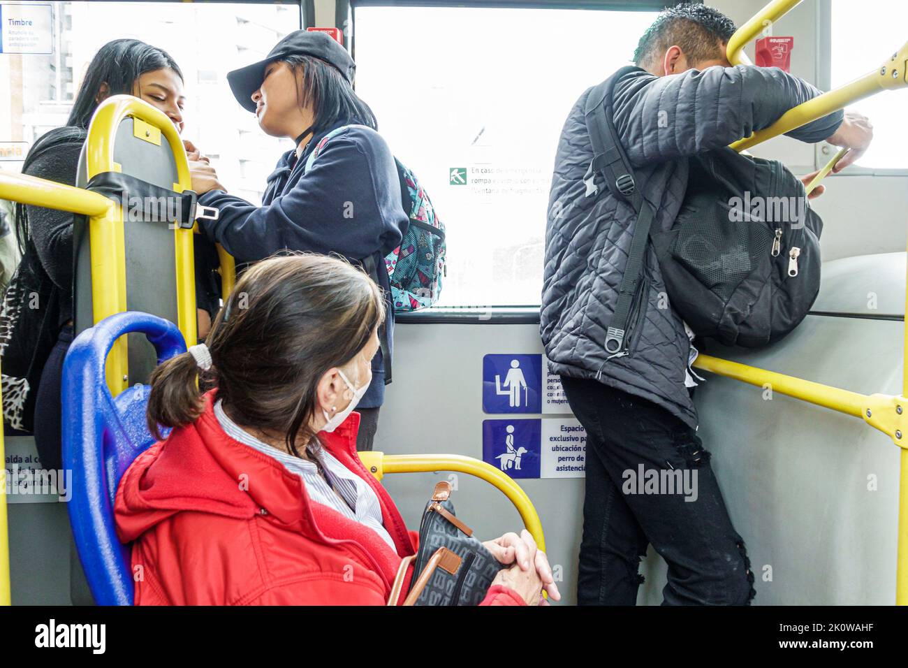 Bogota Colombia,San Victorino Carrera 10 riding Transmilenio route D206 passengers,teen teens teenage teenager teenagers youth,bus rapid transit syste Stock Photo