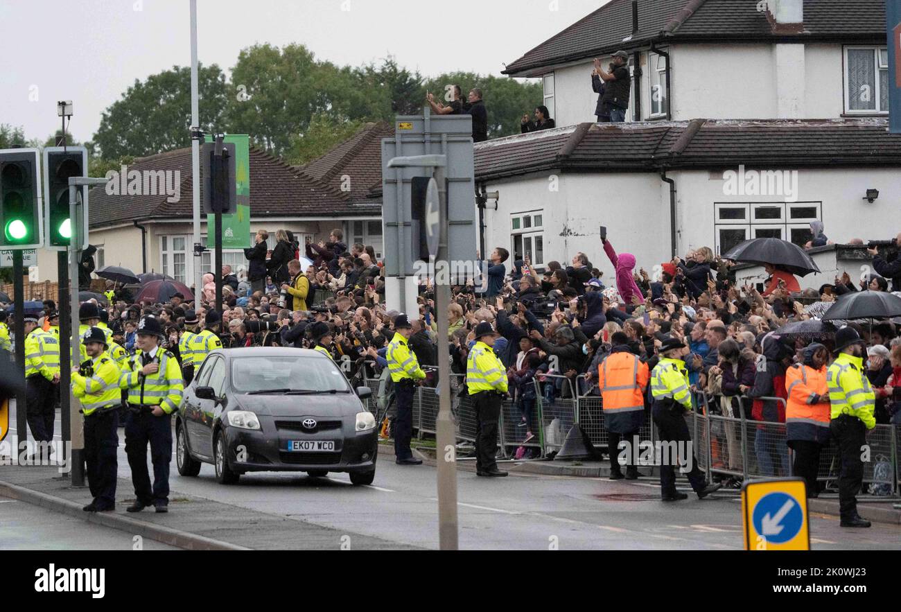 Crowds wait for the hearse carrying the coffin of Queen Elizabeth II to leave RAF Northolt to head to Buckingham Place -September 13, 2022 Stock Photo