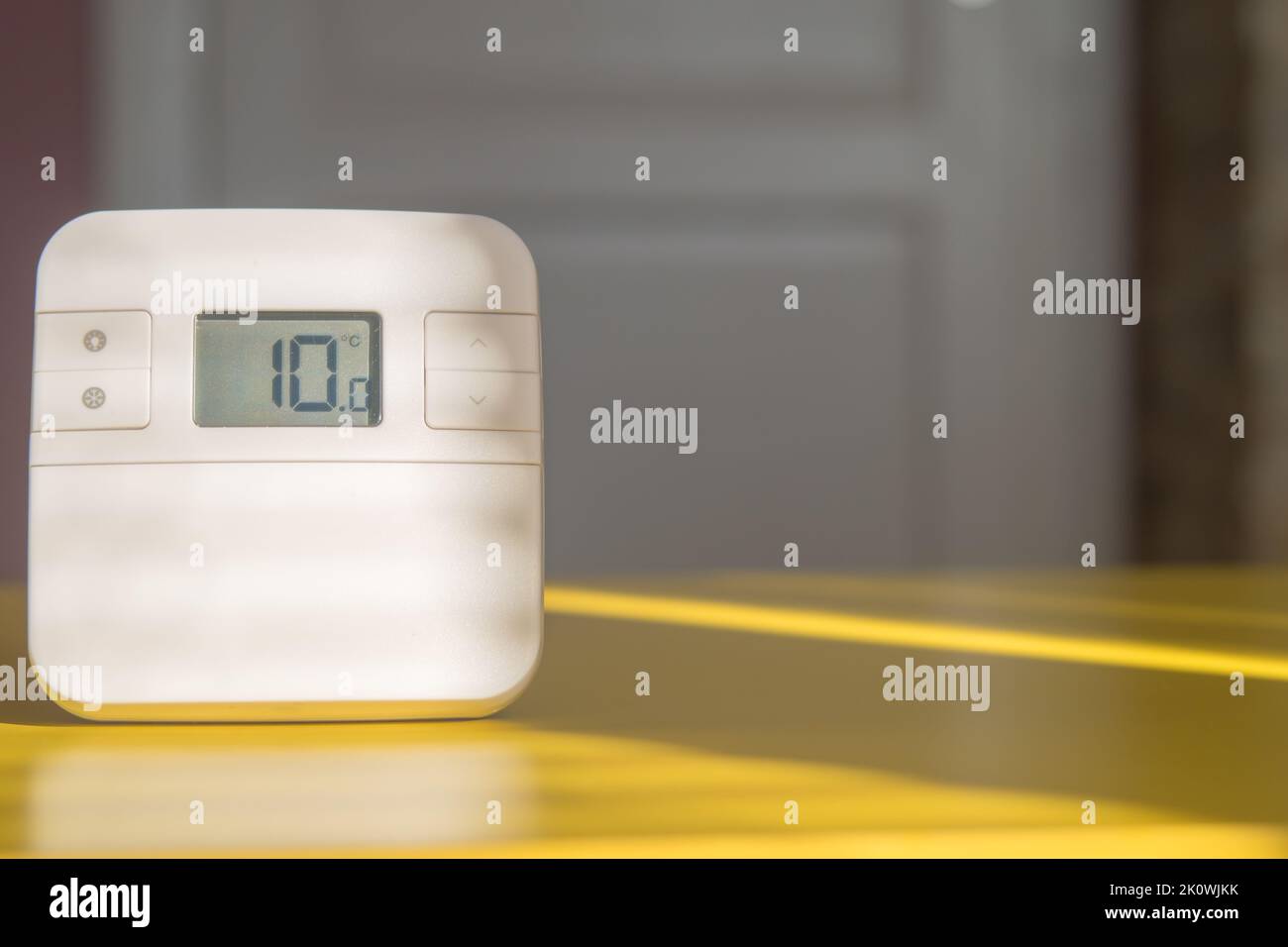 Home thermostat set to maintain the lowest temperature. Concept of gas