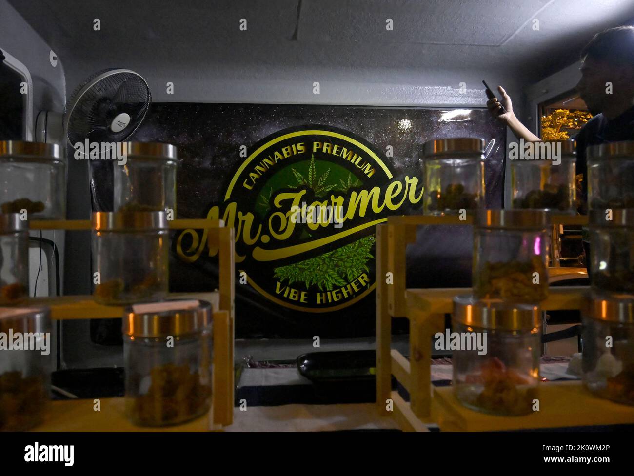 A detail view of the 'Mr Farmer' pop-up truck. In the popular night life area of Thong Lo in downtown Bangkok, marijuana pop-up trucks sell legal marihuana for personal use. The Kingdom of Thailand is the first nation in Asia to decriminalize marijuana for medical and personal use. On June 9, 2022, marihuana was removed from the category of narcotic drugs making it legal to sell and buy the herb. Stock Photo