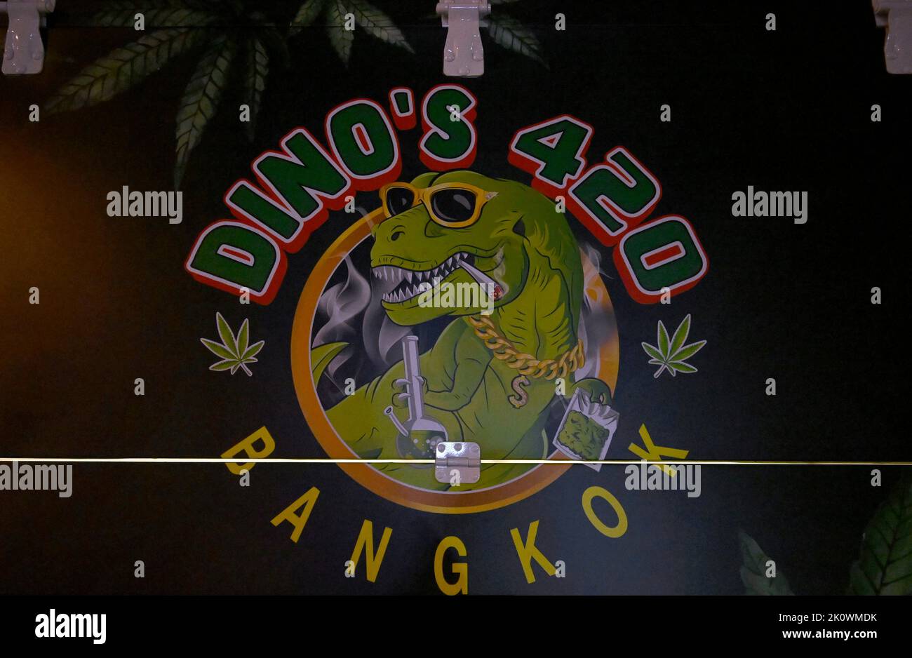 Bangkok, Thailand. 13th Sep, 2022. A close up view of the logo of the 'Dino's 420' pop-up truck. In the popular night life area of Thong Lo in downtown Bangkok, marijuana pop-up trucks sell legal marihuana for personal use. The Kingdom of Thailand is the first nation in Asia to decriminalize marijuana for medical and personal use. On June 9, 2022, marihuana was removed from the category of narcotic drugs making it legal to sell and buy the herb. (Photo by Paul Lakatos/SOPA Images/Sipa USA) Credit: Sipa USA/Alamy Live News Stock Photo