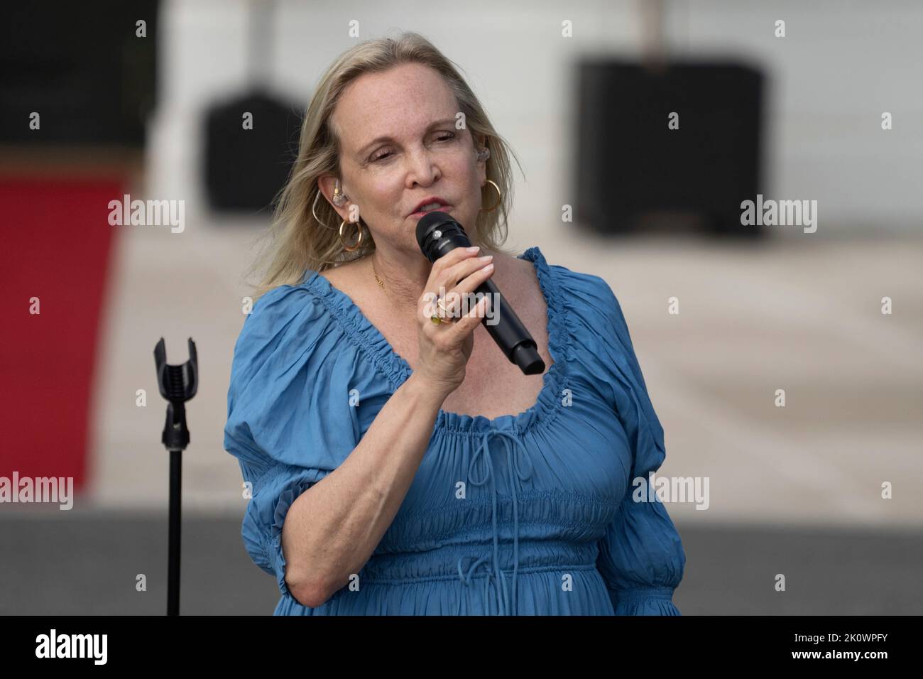 Caroline Smedvig sings at an event celebrating the passage of H.R. 5376