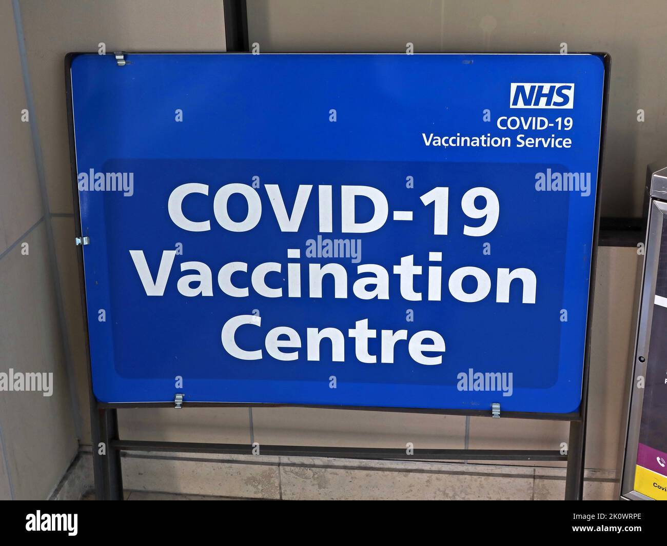 COVID-19 NHS Vaccination Centre sign, Bolton, greater Manchester, England, UK, BL1 Stock Photo