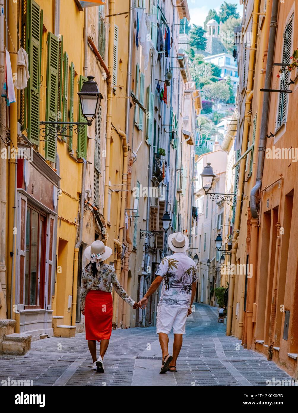 Menton France,couple men and woman on vacation at the Cote d Azur France, View on old part of Menton, Provence-Alpes-Cote d'Azur, France Europe Stock Photo