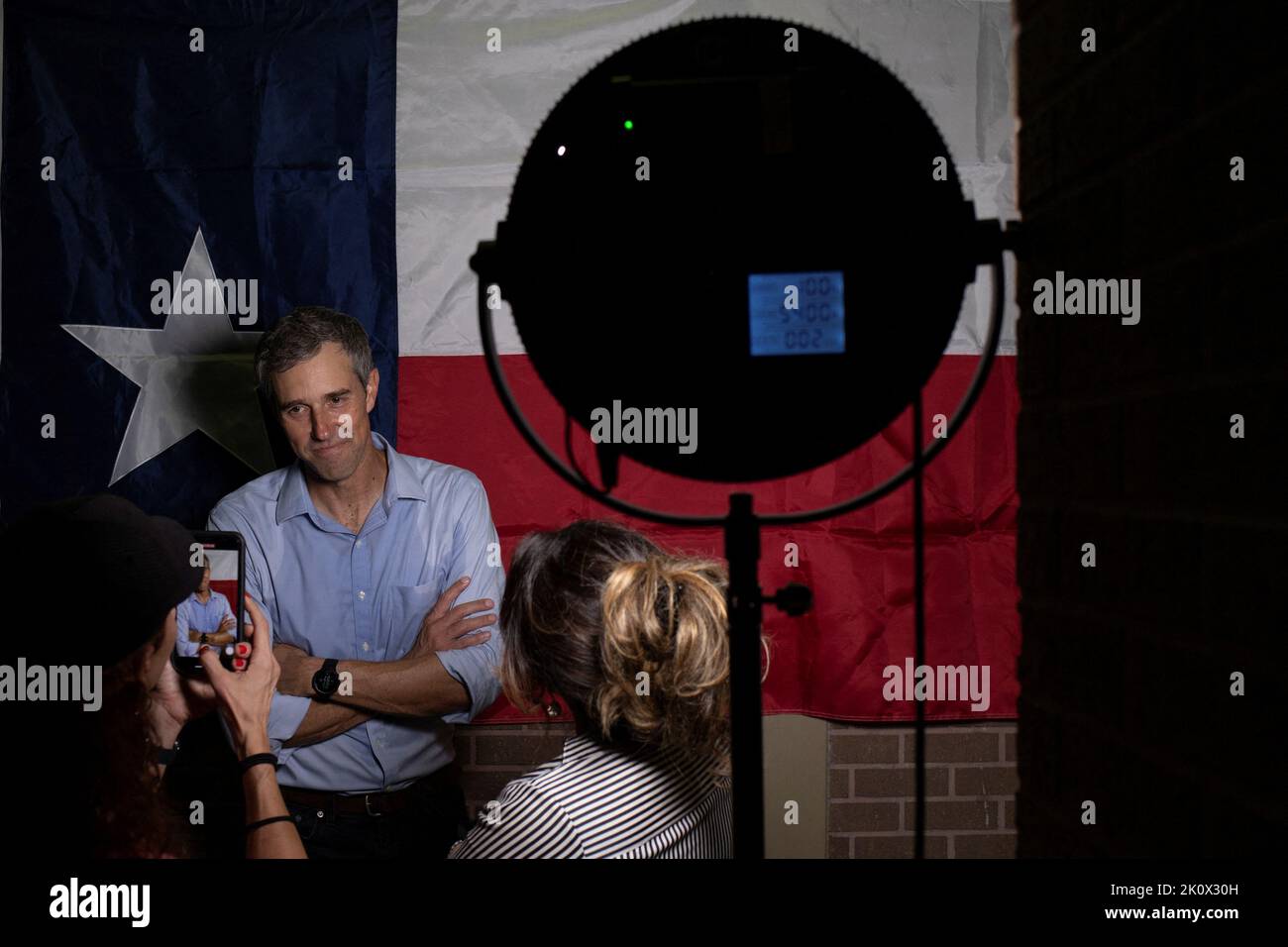 Texas Democratic gubernatorial candidate and former U.S. congressman Beto O'Rourke stands in front of the Texas state flag while posing for photographs during a campaign event in Houston, Texas, U.S. September 13, 2022. REUTERS/Adrees Latif Stock Photo