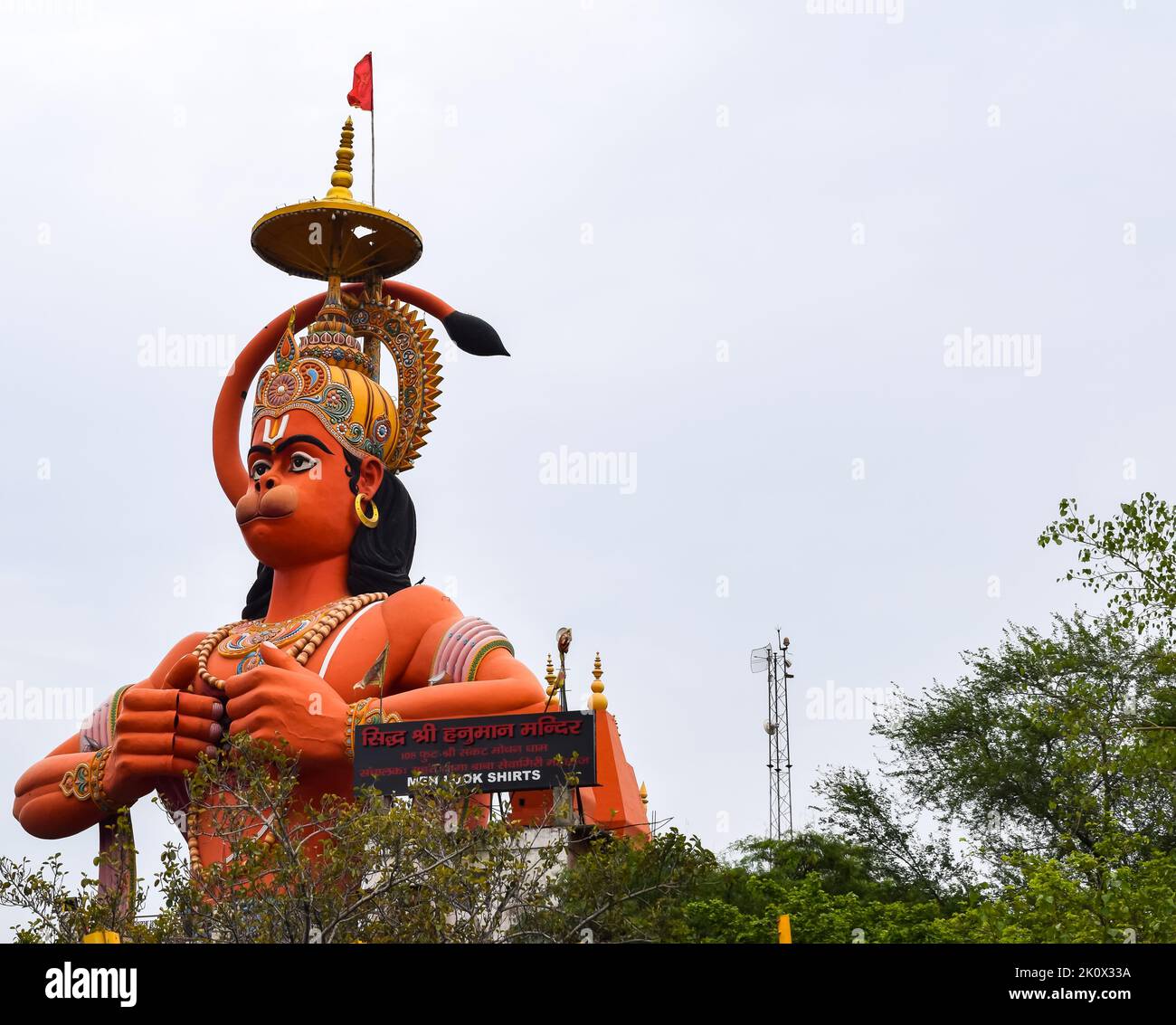 Big statue of Lord Hanuman near the delhi metro bridge situated near Karol Bagh, Delhi, India, Lord Hanuman statue touching sky Stock Photo
