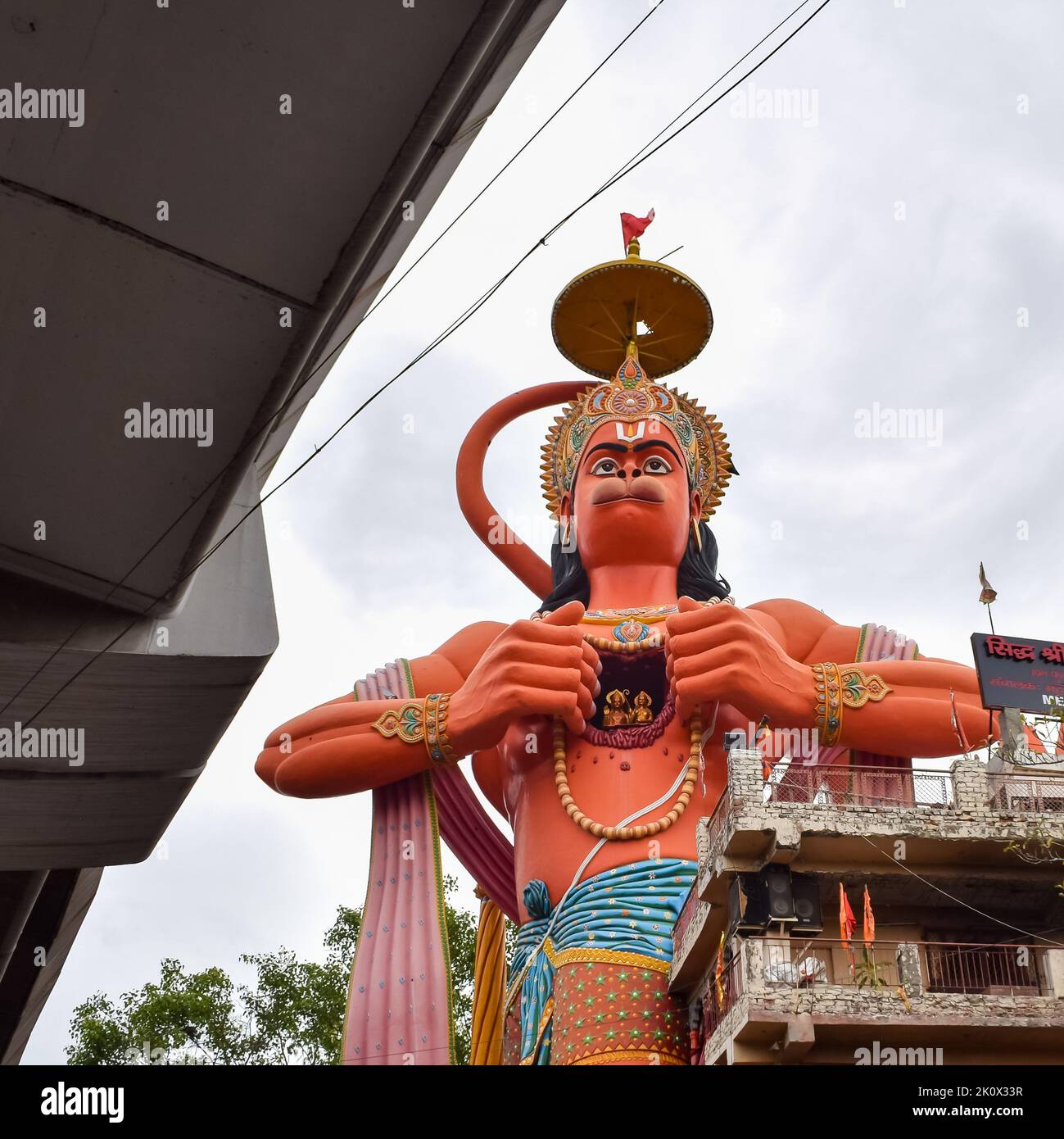 Big statue of Lord Hanuman near the delhi metro bridge situated near