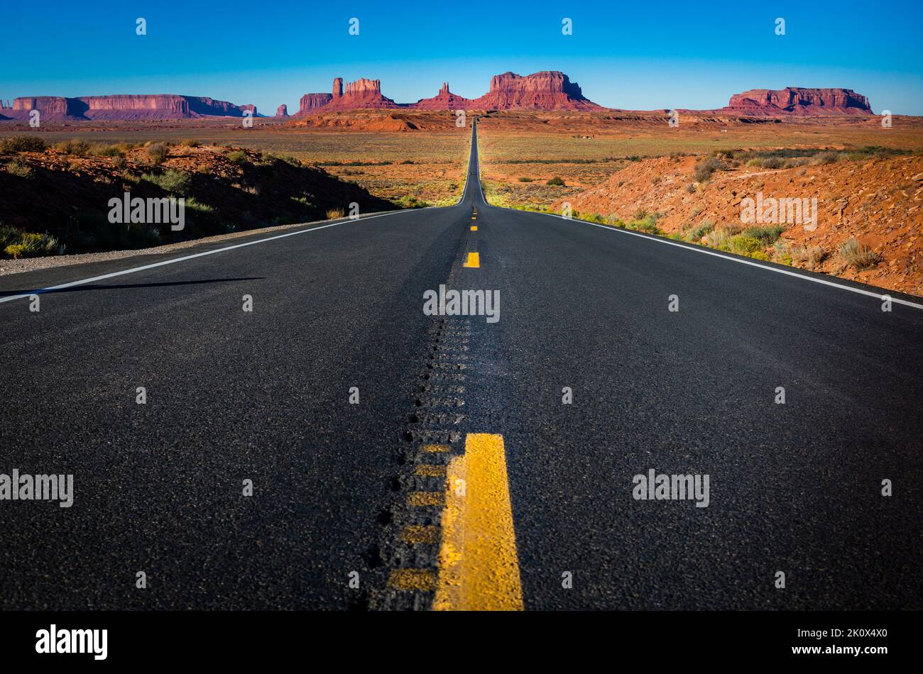 Highway Road U.S. Highway 163 and Monument Valley at sunset, Arizona, USA Stock Photo