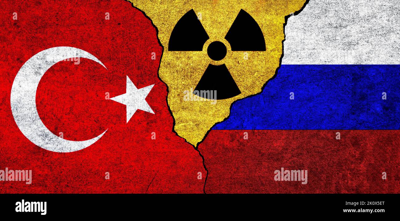 Flags of Turkey, Russia and radiation symbol together. Russia and Turkiye Nuclear deal, threat, agreement, tensions concept Stock Photo