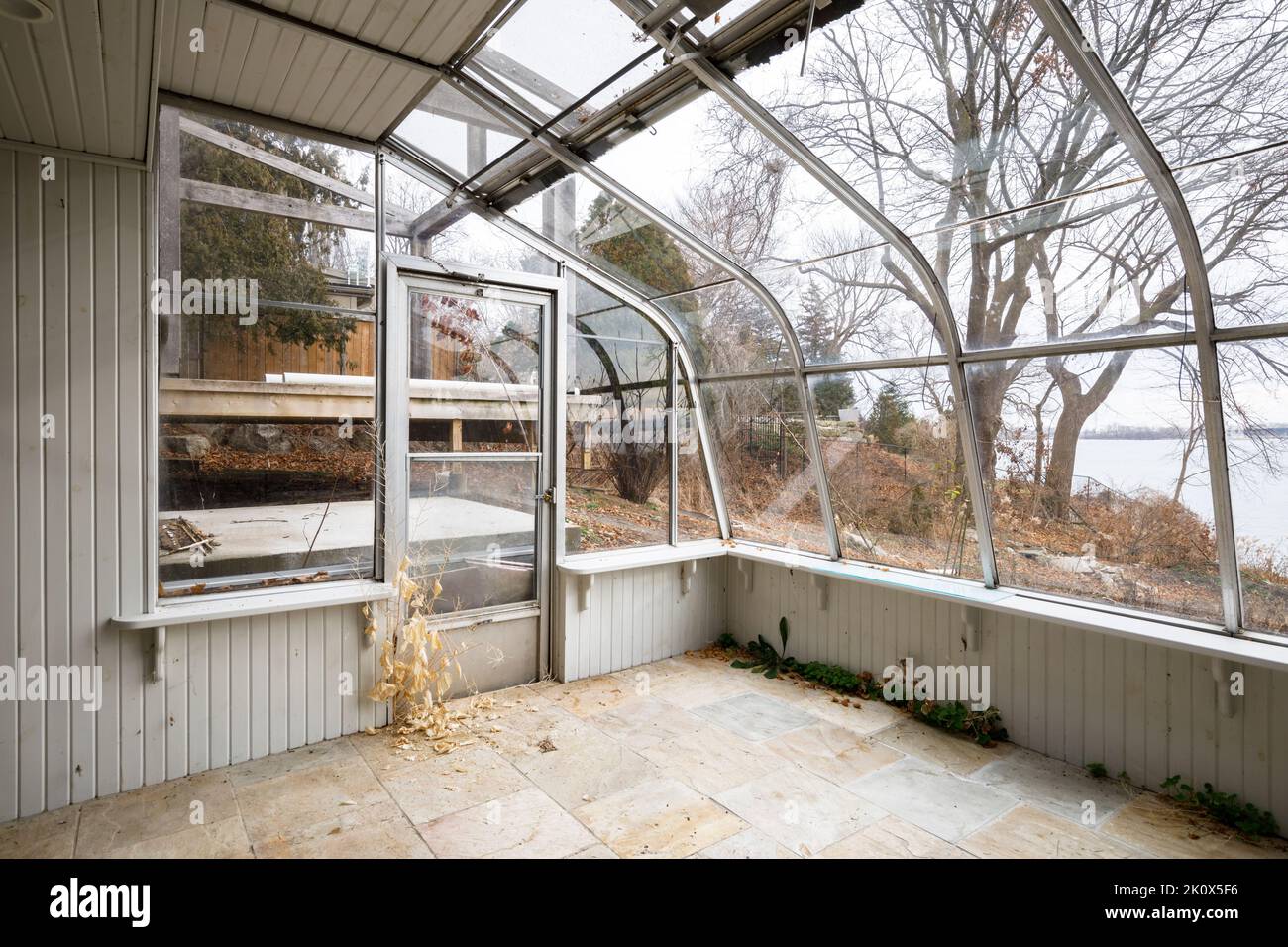 A greenhouse built onto the back of a house. This home has since been demolished. Stock Photo
