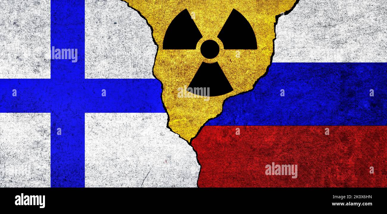 Flags of Finland, Russia and radiation symbol together. Russia and Finland Nuclear deal, threat, agreement, tensions concept Stock Photo