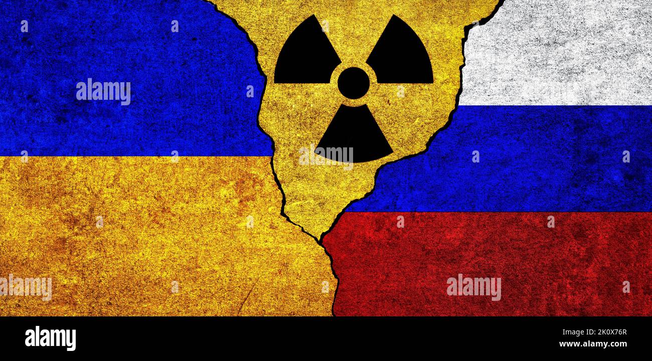 Flags of Ukraine, Russia and radiation symbol together. Russia and Ukraine Nuclear deal, threat, agreement, tensions concept Stock Photo
