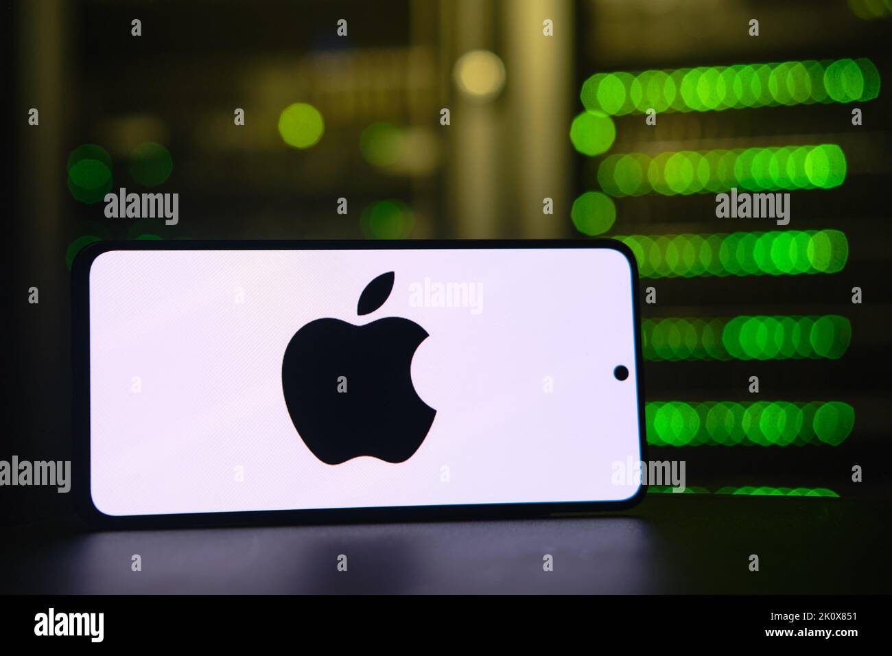 Apple iphone company logo on the background of a bokeh server light - Moscow, Russia, August 27, 2022 Stock Photo
