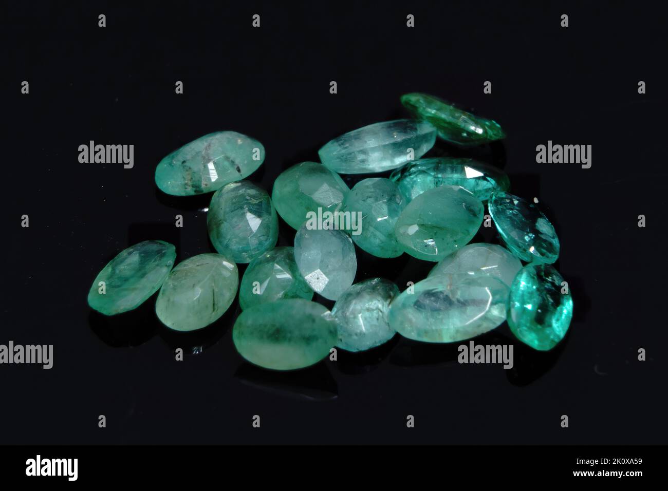 Natural gemstone green emerald on black background Stock Photo Alamy
