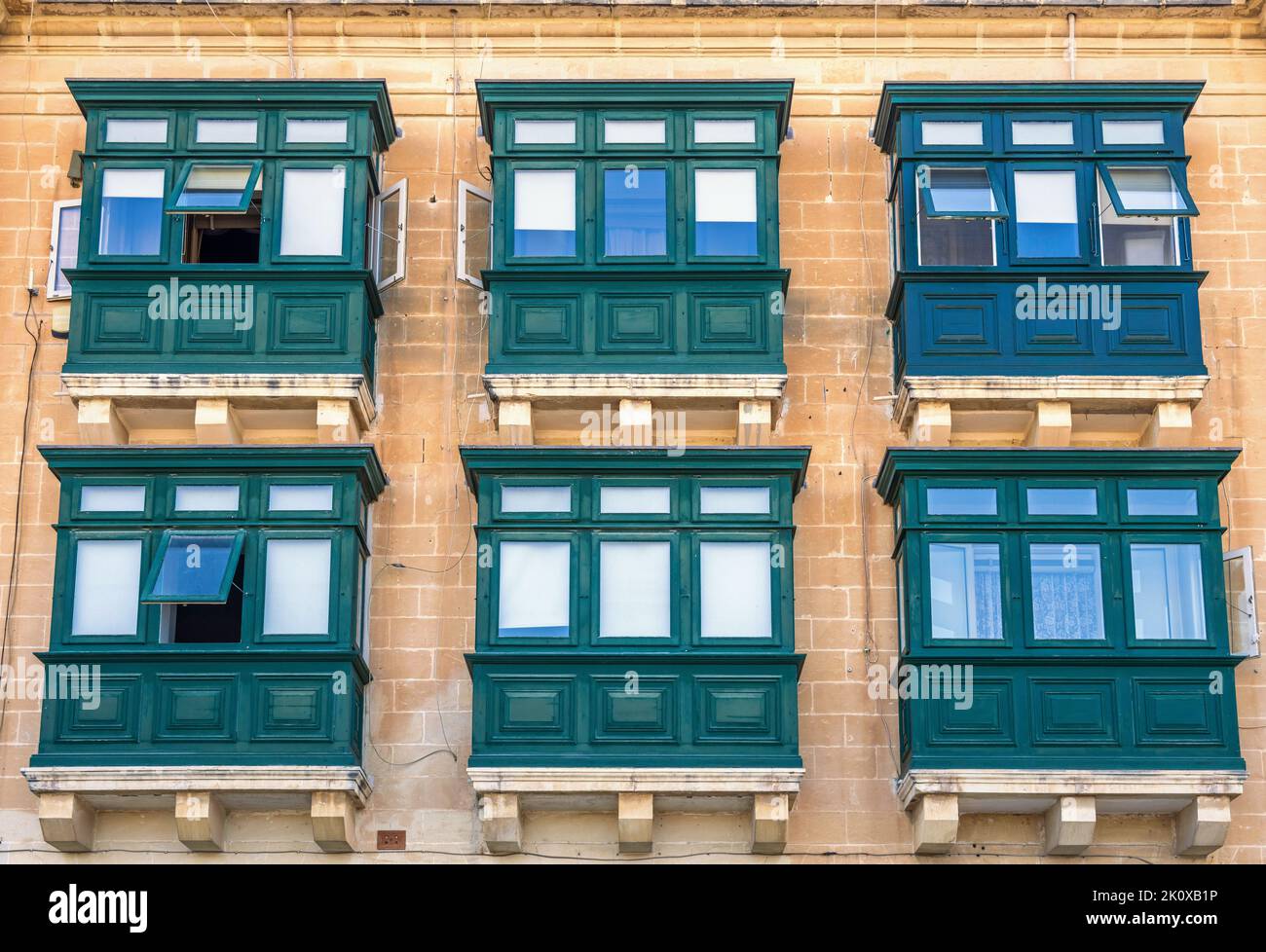 Traditional Maltese wooden balconies. Stock Photo