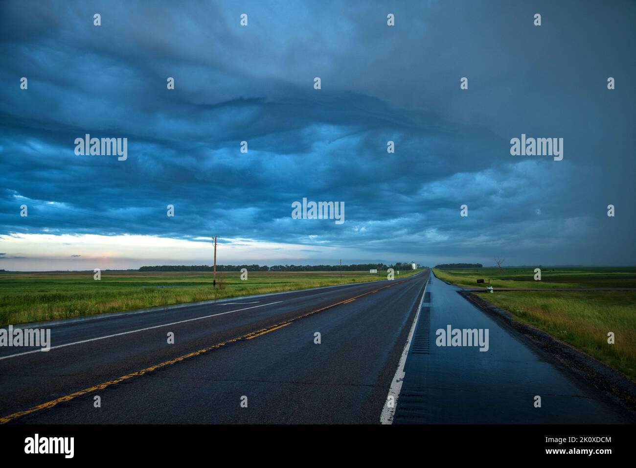 USA, Great Plains, North Dakota, Jamestown, stormy road Stock Photo