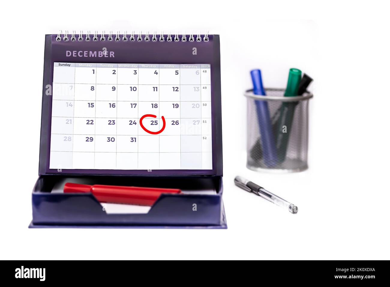 Red circle round date of 25th December  (Christmas Day) on a business desk diary isolated on a white background Stock Photo