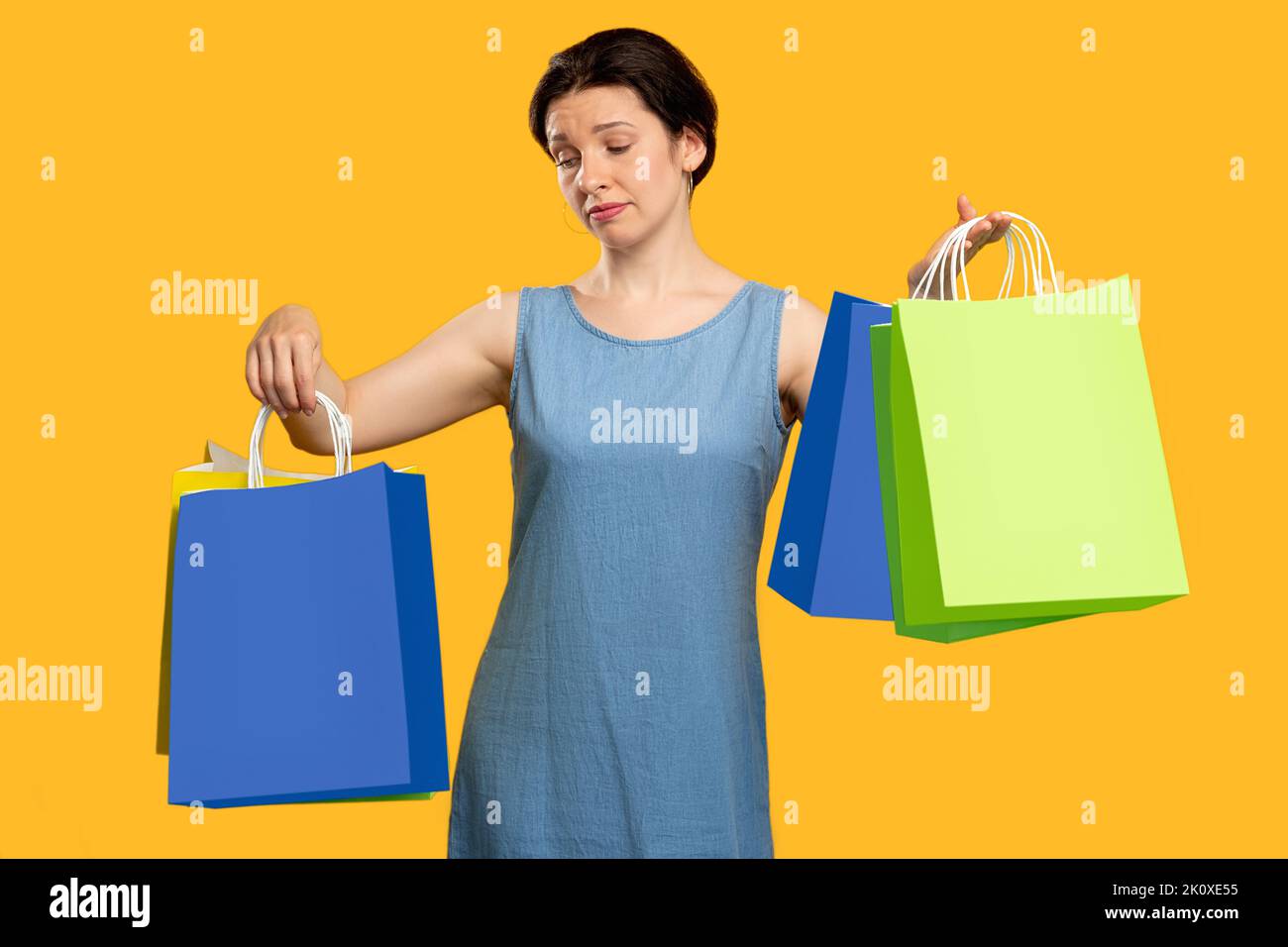 shopping addiction disappointed emotion sad woman Stock Photo