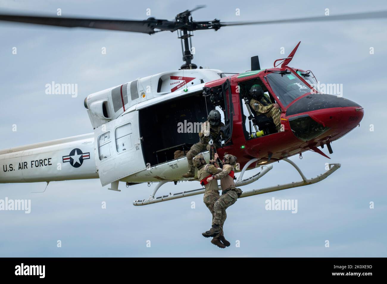 Eglin Air Force Base, Florida, USA. 23rd Aug, 2022. Tech. Sgt. Alexander Graves, an Air Force Global Strike Command Det. 7 special missions aviator, helps pull in Airmen on the 413th Flight Test Squadron UH-1 Hueys hoist at Eglin Air Force Base, Florida August. 23. The 413th FLTS, the Air Forces only rotary wing developmental test unit, provided an extra bit of realism to the tactical air control party Airmens extraction training. Credit: U.S. Air Force/ZUMA Press Wire Service/ZUMAPRESS.com/Alamy Live News Stock Photo