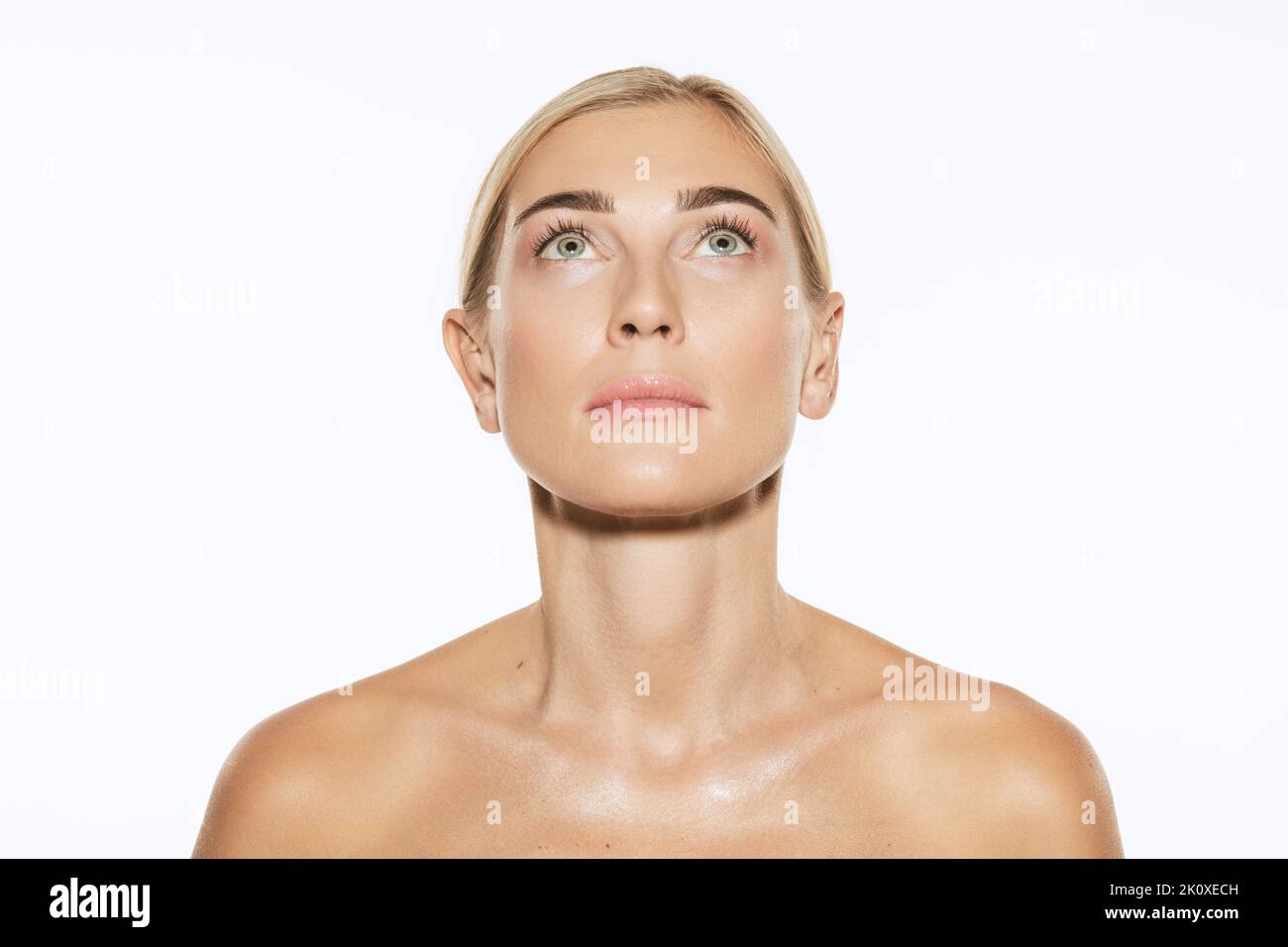 Young, beautiful 35 years old woman with well-kept skin isolated on white background. Spa, anti-aging treatment, face lifting and skin care concept Stock Photo