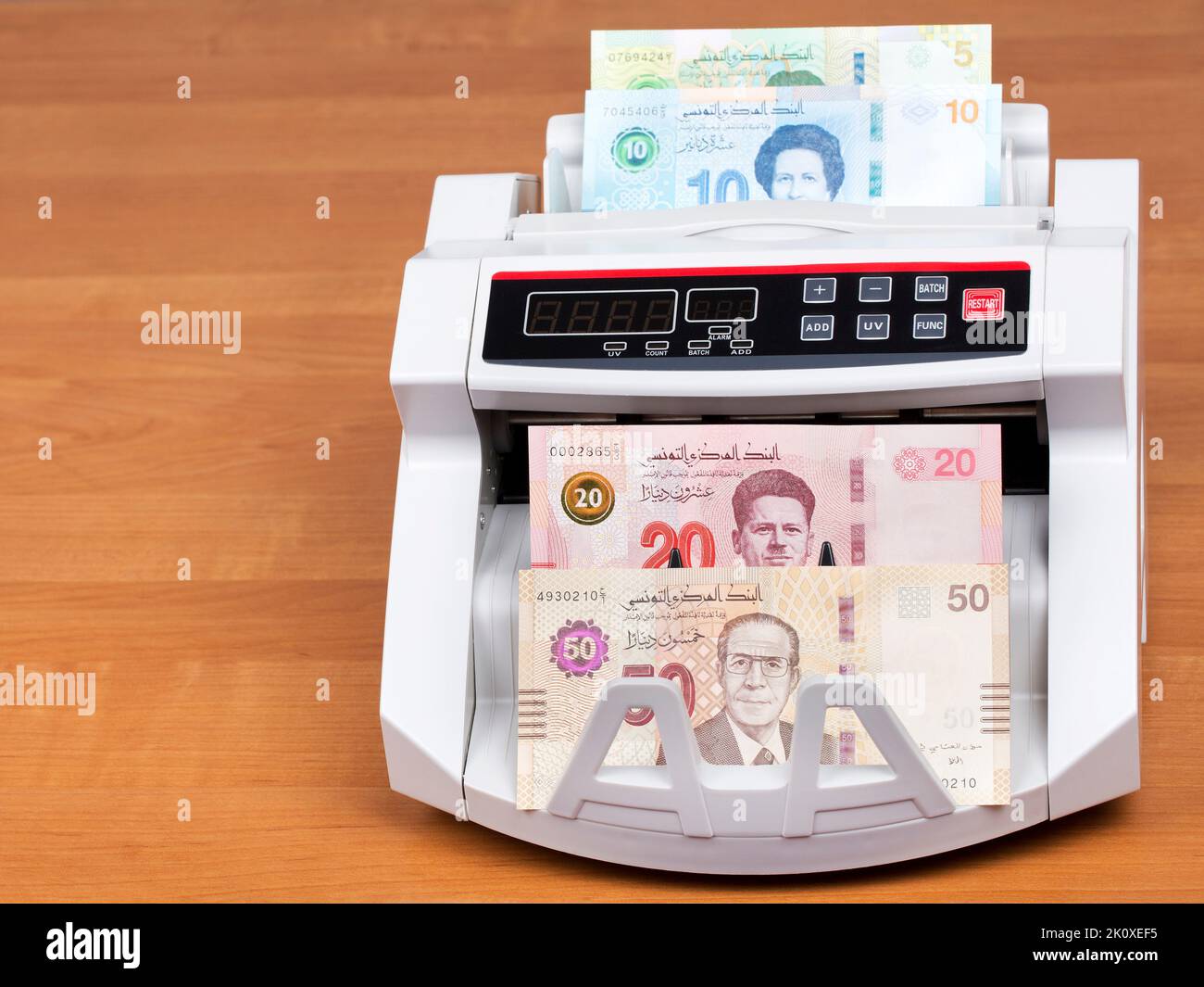 Tunisian money - Dinars  in a counting machine Stock Photo