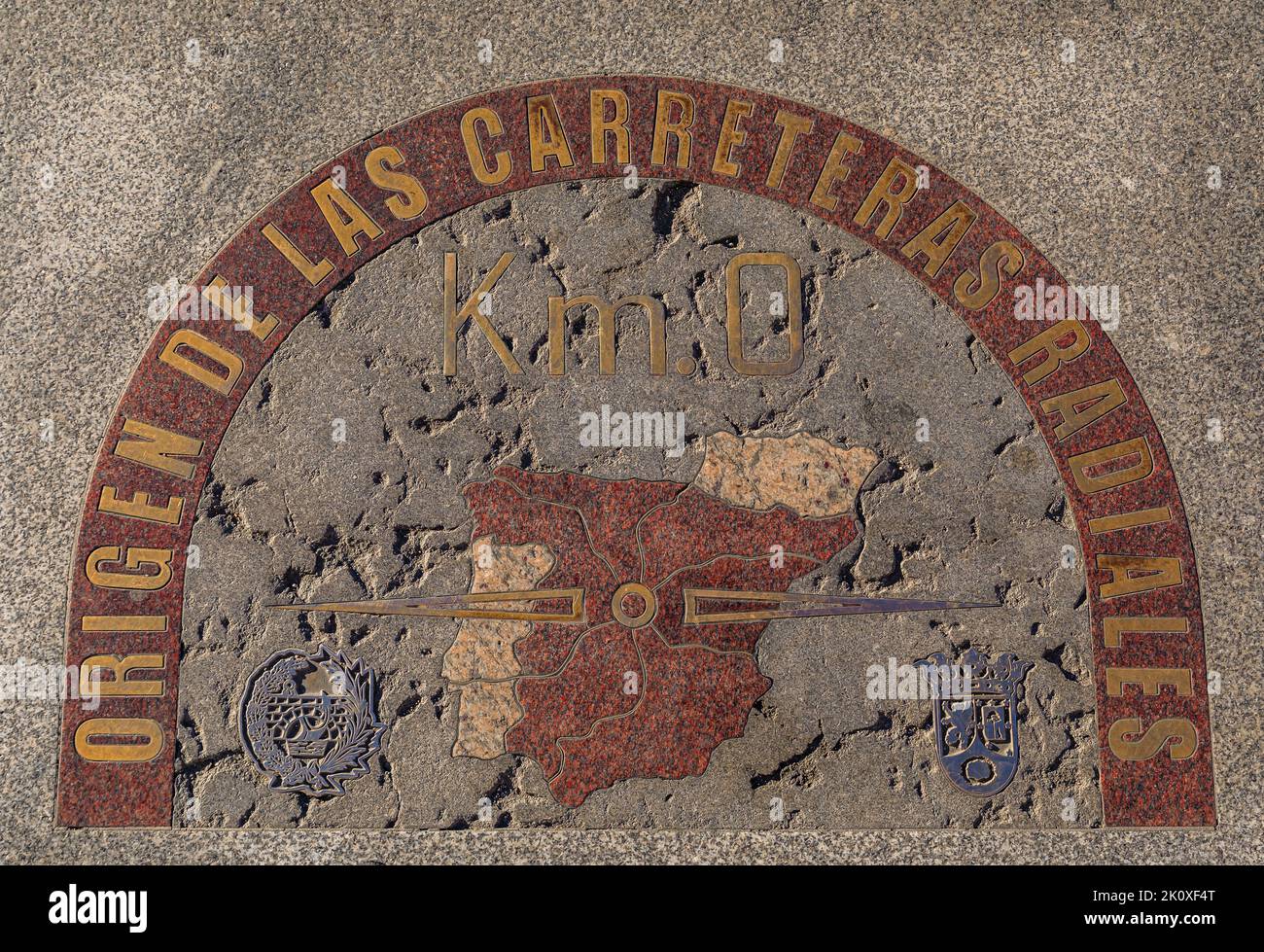 Zero kilometer or Kilometro Cero granite and brass plaque on Puerta del Sol square in center of Madrid, Spain marking the start of 6 national highways Stock Photo