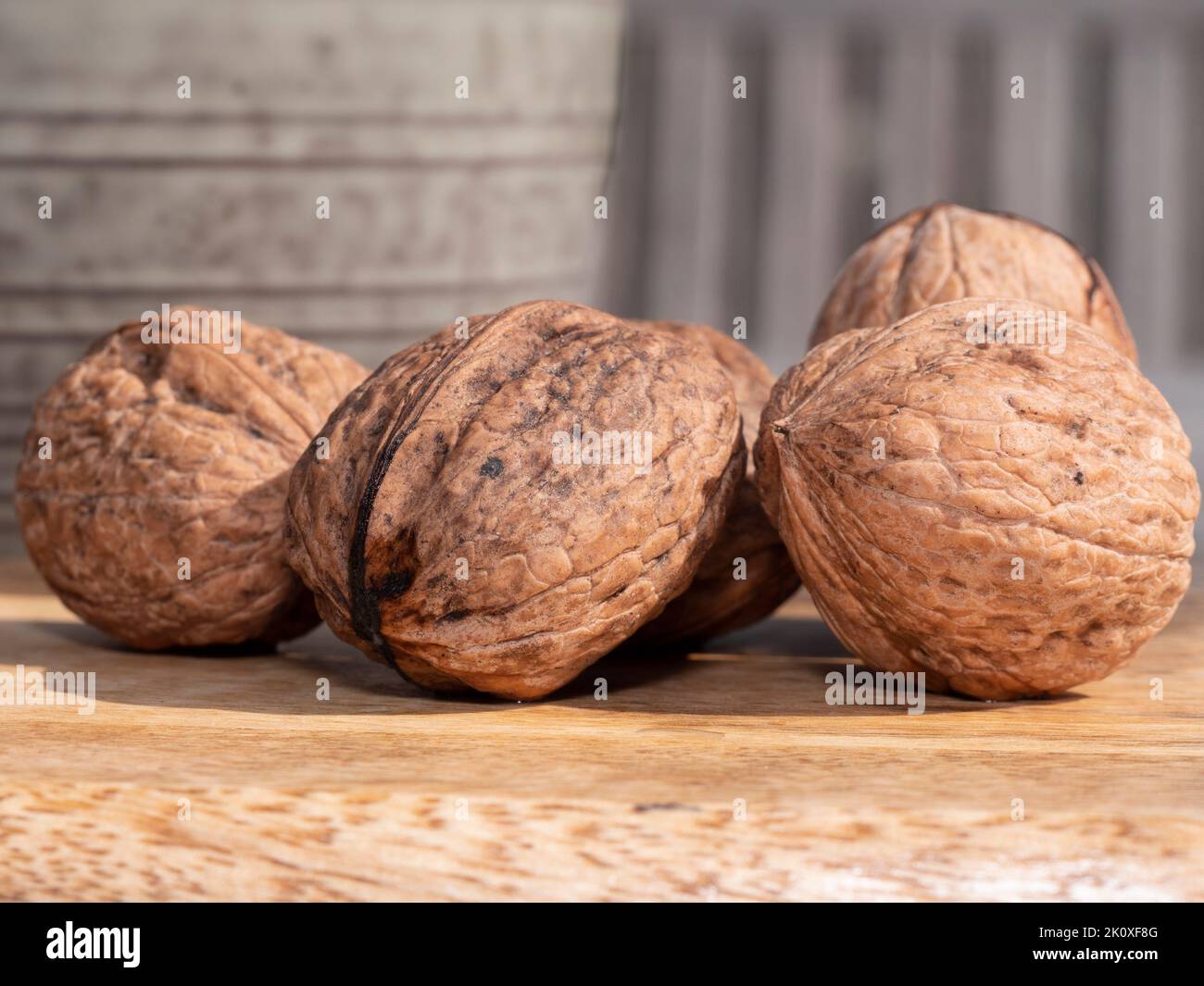 Close up of big beautiful walnuts on a wooden board Stock Photo