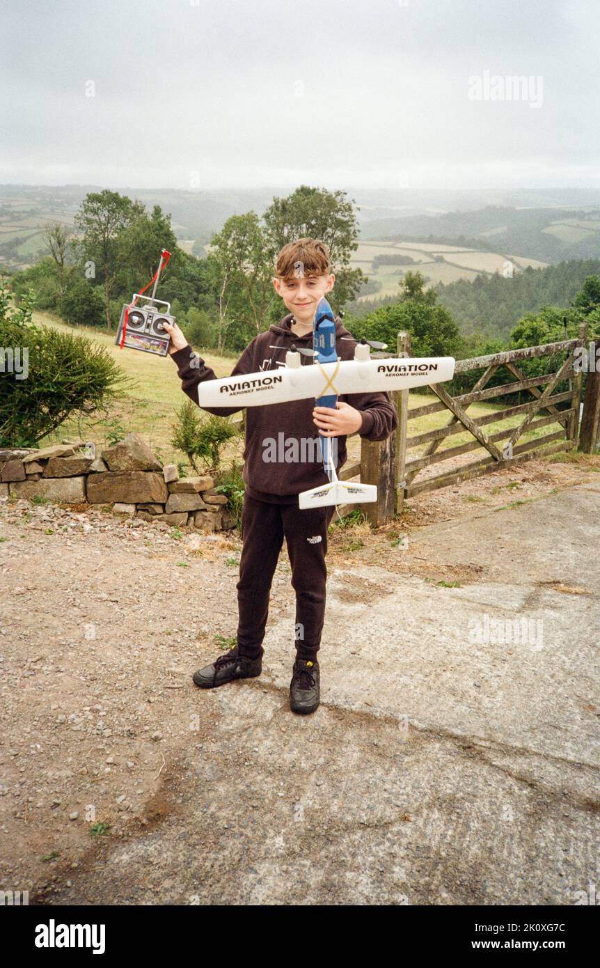 Boy with a radio controlled model aeroplane, High Bickington, North Devon, England, United Kingdom. Stock Photo