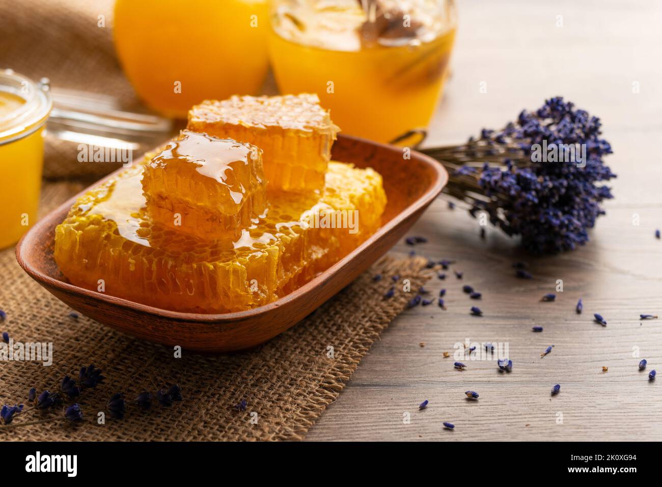 Honeycomb in clay dish on kitchen table sweet background Stock Photo