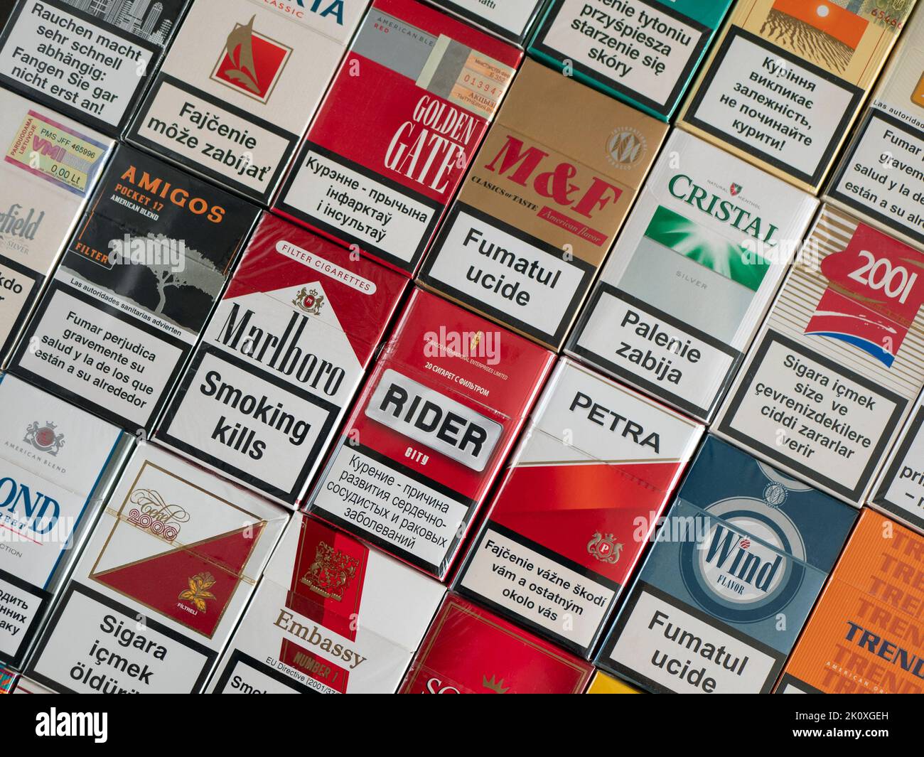 Soligorsk, Belarus - 5 September 2022: Cigarette packs with the calling to stop smoking in different languages. Smoking kills Stock Photo