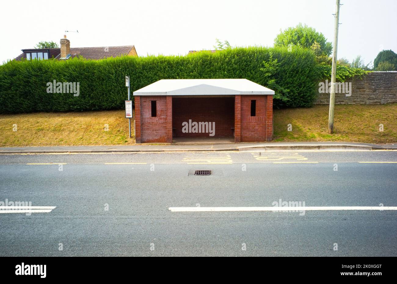 A very boring brick built bus shelter in Cayton, North Yorkshire Stock Photo
